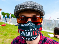 A student is wearing a mouth mask with the message it's not my fault, the slogan of the protest, during the Nationwide student strike, organ...