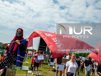 A student wearing a hijab is holding a flag, during the Nationwide student strike, organized in The Hague, Netherlands on June 3rd, 2021. (