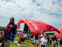 A student wearing a hijab is holding a flag, during the Nationwide student strike, organized in The Hague, Netherlands on June 3rd, 2021. (