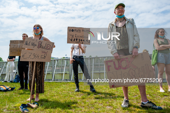 A group of students are holding placards against the student loan system, during the Nationwide student strike, organized in The Hague, Neth...