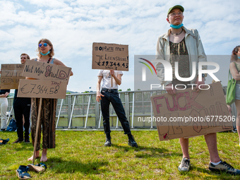 A group of students are holding placards against the student loan system, during the Nationwide student strike, organized in The Hague, Neth...