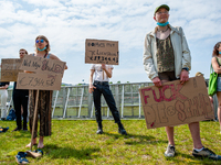 A group of students are holding placards against the student loan system, during the Nationwide student strike, organized in The Hague, Neth...