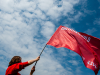 A student is holding a big red flag that says it's not my fault, the slogan of the student protest, during the Nationwide student strike, or...