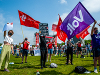 Several students are holding flags from different political parties, during the Nationwide student strike, organized in The Hague, Netherlan...