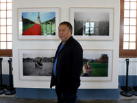 Chinese artist Ai Weiwei walks by his artworks during a press preview of his new exhibition 'Rapture'  at the Cordoaria Nacional in Lisbon,...