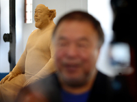 Chinese artist Ai Weiwei Brainless Figure in Cork" self-portrait sculpture made of cork is seen as the artist speaks to journalists during a...