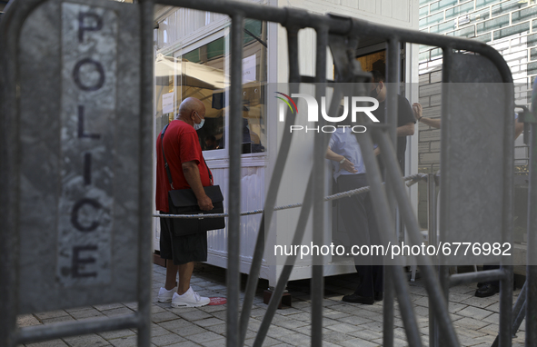 A man waits to cross the re-opened Ledra's Street checkpoint next to the UN buffer zone, after almost one year close down in Nicosia. Cyprus...