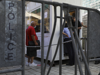 A man waits to cross the re-opened Ledra's Street checkpoint next to the UN buffer zone, after almost one year close down in Nicosia. Cyprus...