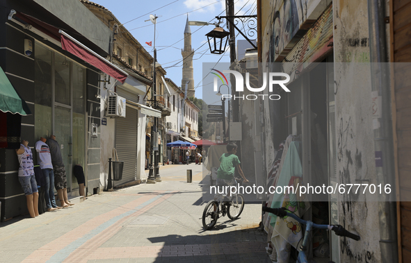 A Turkish Cypriot boy rides a bicycle along a shopping street in Turkish-occupied territory in the northern part of the divided capital Nico...