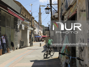 A Turkish Cypriot boy rides a bicycle along a shopping street in Turkish-occupied territory in the northern part of the divided capital Nico...