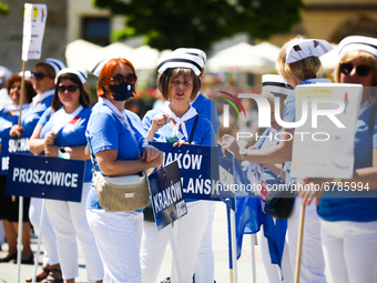 Polish nurses and midwives protest during Warning Strike at the Main Square in Krakow, Poland, on June 7, 2021. Nurses and midwives from aro...