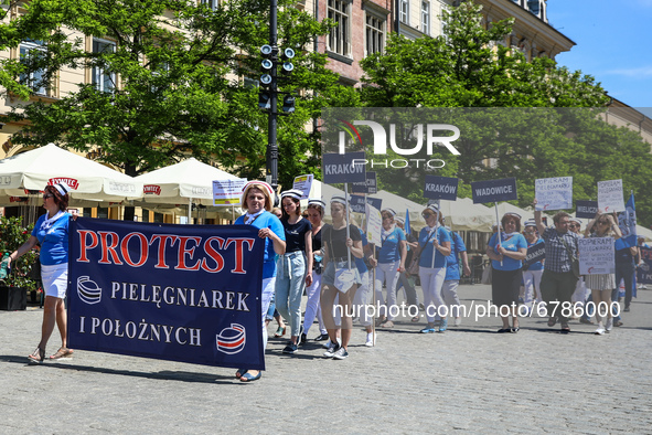 Polish nurses and midwives protest during Warning Strike at the Main Square in Krakow, Poland, on June 7, 2021. Nurses and midwives from aro...