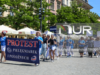 Polish nurses and midwives protest during Warning Strike at the Main Square in Krakow, Poland, on June 7, 2021. Nurses and midwives from aro...