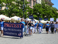 Polish nurses and midwives protest during Warning Strike at the Main Square in Krakow, Poland, on June 7, 2021. Nurses and midwives from aro...