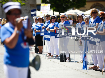 Polish nurses and midwives protest during Warning Strike at the Main Square in Krakow, Poland, on June 7, 2021. Nurses and midwives from aro...