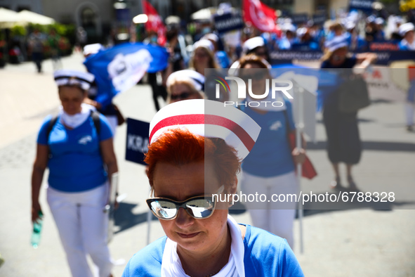 Polish nurses and midwives protest during Warning Strike at the Main Square in Krakow, Poland, on June 7, 2021. Nurses and midwives from aro...