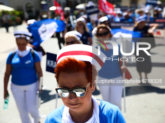 Polish nurses and midwives protest during Warning Strike at the Main Square in Krakow, Poland, on June 7, 2021. Nurses and midwives from aro...