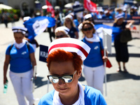 Polish nurses and midwives protest during Warning Strike at the Main Square in Krakow, Poland, on June 7, 2021. Nurses and midwives from aro...