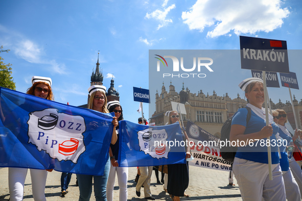 Polish nurses and midwives protest during Warning Strike at the Main Square in Krakow, Poland, on June 7, 2021. Nurses and midwives from aro...