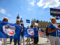 Polish nurses and midwives protest during Warning Strike at the Main Square in Krakow, Poland, on June 7, 2021. Nurses and midwives from aro...