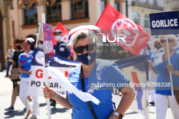 Polish nurses and midwives protest during Warning Strike at the Main Square in Krakow, Poland, on June 7, 2021. Nurses and midwives from aro...