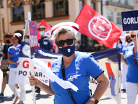 Polish nurses and midwives protest during Warning Strike at the Main Square in Krakow, Poland, on June 7, 2021. Nurses and midwives from aro...