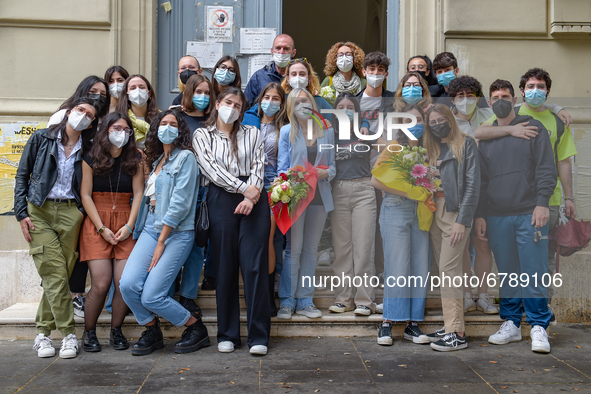 Last day of lessons of a difficult school year, smiles hidden among the masks and water balloons to celebrate the last day of school, with t...