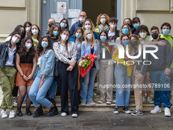 Last day of lessons of a difficult school year, smiles hidden among the masks and water balloons to celebrate the last day of school, with t...