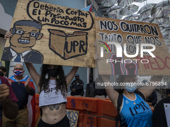 Teacher, Students and Workers of the UPR (University of Puerto Rico) protest against a budget cut of $94 million imposed by the Fiscal Contr...