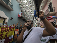 Teacher, Students and Workers of the UPR (University of Puerto Rico) protest against a budget cut of $94 million imposed by the Fiscal Contr...