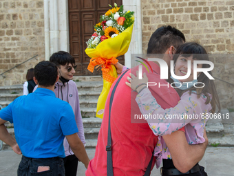 A fifth-year student embraces her father as soon as she has finished her high-school leaving examination in Rieti, Italy, on June 16, 2021....