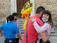 A fifth-year student embraces her father as soon as she has finished her high-school leaving examination in Rieti, Italy, on June 16, 2021....