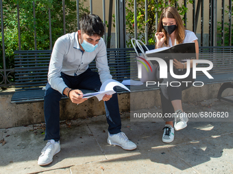 Students last quick review before going in for the oral interview  their exam subjects while waiting for their turn outside the high school...