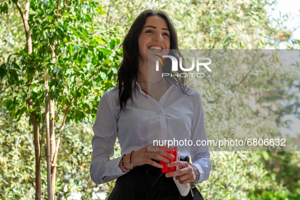 A fifth-year student smiles as she has finished her high-school leaving examination in Rieti, Italy, on June 16, 2021. High-school graduatio...