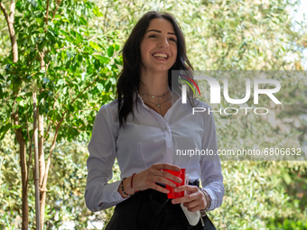 A fifth-year student smiles as she has finished her high-school leaving examination in Rieti, Italy, on June 16, 2021. High-school graduatio...