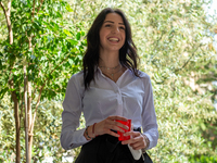 A fifth-year student smiles as she has finished her high-school leaving examination in Rieti, Italy, on June 16, 2021. High-school graduatio...