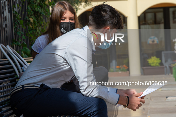 Students last quick review before going in for the oral interview  their exam subjects while waiting for their turn outside the high school...