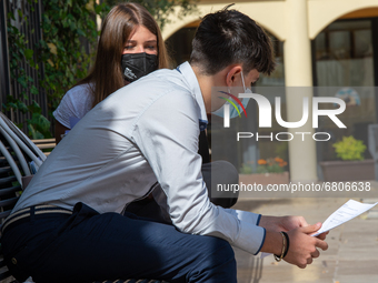 Students last quick review before going in for the oral interview  their exam subjects while waiting for their turn outside the high school...