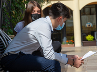 Students last quick review before going in for the oral interview  their exam subjects while waiting for their turn outside the high school...