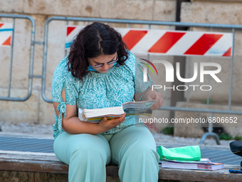 Students last quick review before going in for the oral interview  their exam subjects while waiting for their turn outside the high school...