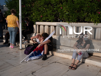  A couple during a demonstration in Athens, Greece, on June 16, 2021. Thousands of Athenians gathered outside the parliament to protest agai...