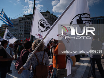  Demonstrators holding flags during a general strike in Athens, Greece, on June 16, 2021. Thousands of Athenians gathered outside the parlia...