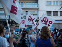  A woman raising her fist during a protest in Athens, Greece, on June 16, 2021. Thousands of Athenians gathered outside the parliament to pr...