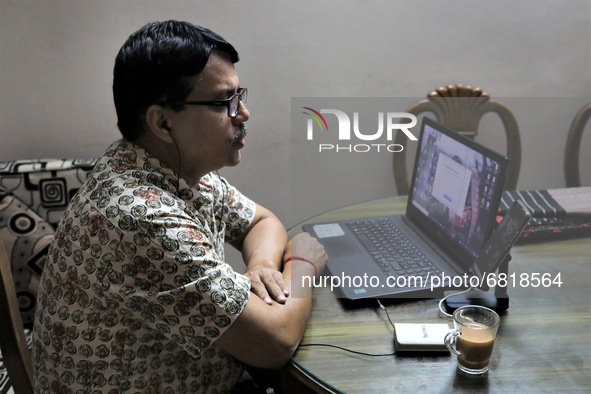 Rajaram Paul Chowdhury teaches an online high school English class from  his home during a government imposed lockdown in Dhaka , Bangladesh...