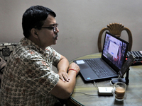 Rajaram Paul Chowdhury teaches an online high school English class from  his home during a government imposed lockdown in Dhaka , Bangladesh...