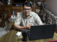 Rajaram Paul Chowdhury teaches an online high school English class from  his home during a government imposed lockdown in Dhaka , Bangladesh...