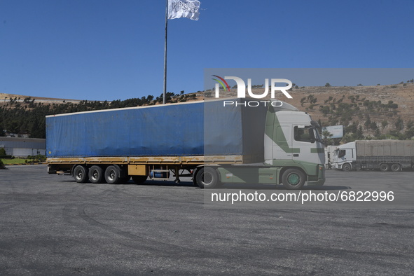 Trucks Loaded With Humanitarian Aid Provided By The United Nations World Food Program Enter Northern Syria Through Bab Al-Hawa Crossing on J...