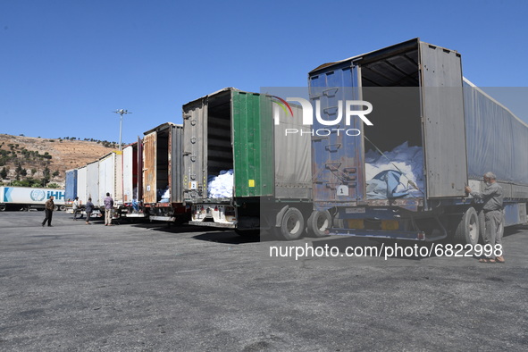 Trucks Loaded With Humanitarian Aid Provided By The United Nations World Food Program Enter Northern Syria Through Bab Al-Hawa Crossing on J...