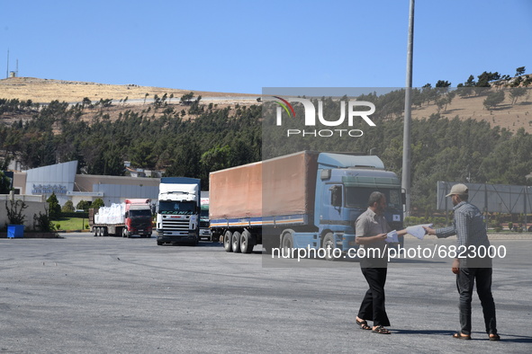 Trucks Loaded With Humanitarian Aid Provided By The United Nations World Food Program Enter Northern Syria Through Bab Al-Hawa Crossing on J...