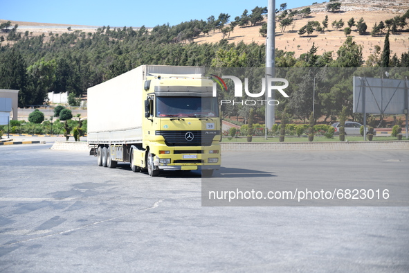 Trucks Loaded With Humanitarian Aid Provided By The United Nations World Food Program Enter Northern Syria Through Bab Al-Hawa Crossing on J...